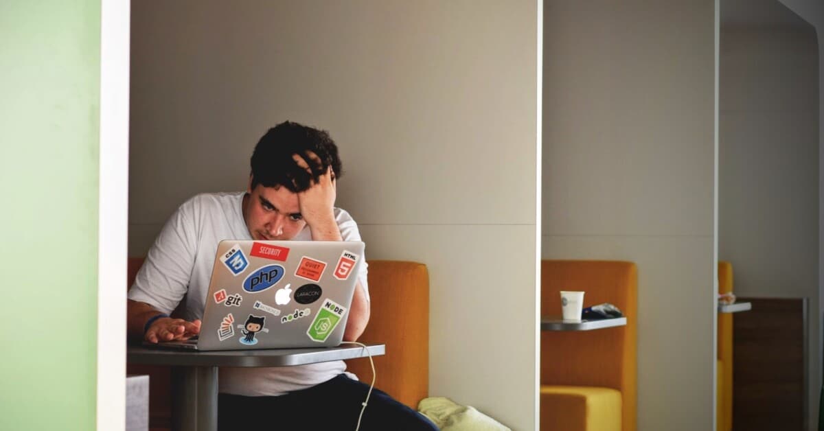A college man is stressed while sitting in front of his laptop. Are you struggling adjusting to college life? Counseling for college students in Evanston, IL can help. Contact a therapist for college students in Illinois to learn more today!