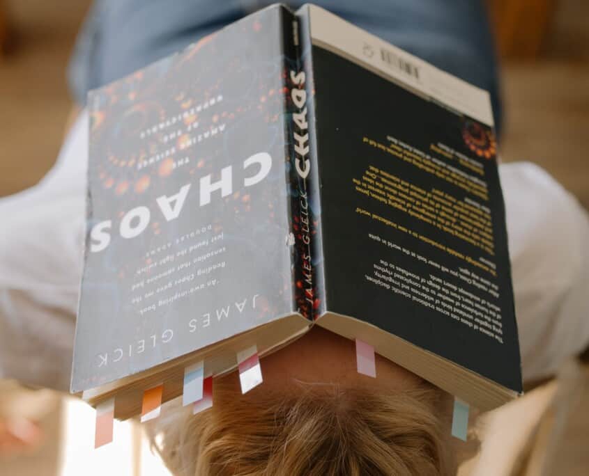 A person lays down with a book on their face. Tired of your anxiety stopping you from succeeding in college? Therapy for anxiety could be for you. Call today to speak with an anxiety therapist!