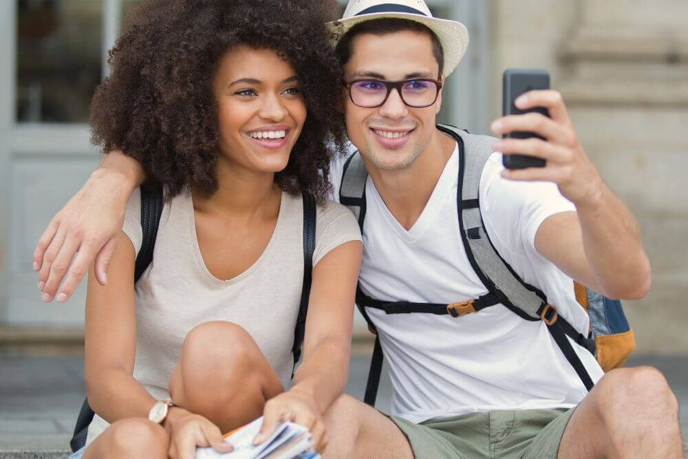 A man sits with a woman taking a selfie. Tired of letting anxiety and fear control your happiness? Cognitive Behavioral Therapy in Evanston, IL might be your answer. A CBT therapist in Illinois can help. Reach out!