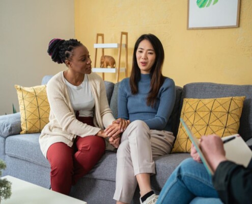 Two women in a therapy session. Looking to find and LGBTQ+ Affirming therapist in Evanston, IL? It might be time to start LGBTQ+ Affirming Therapy in Illinois. Reach out today!