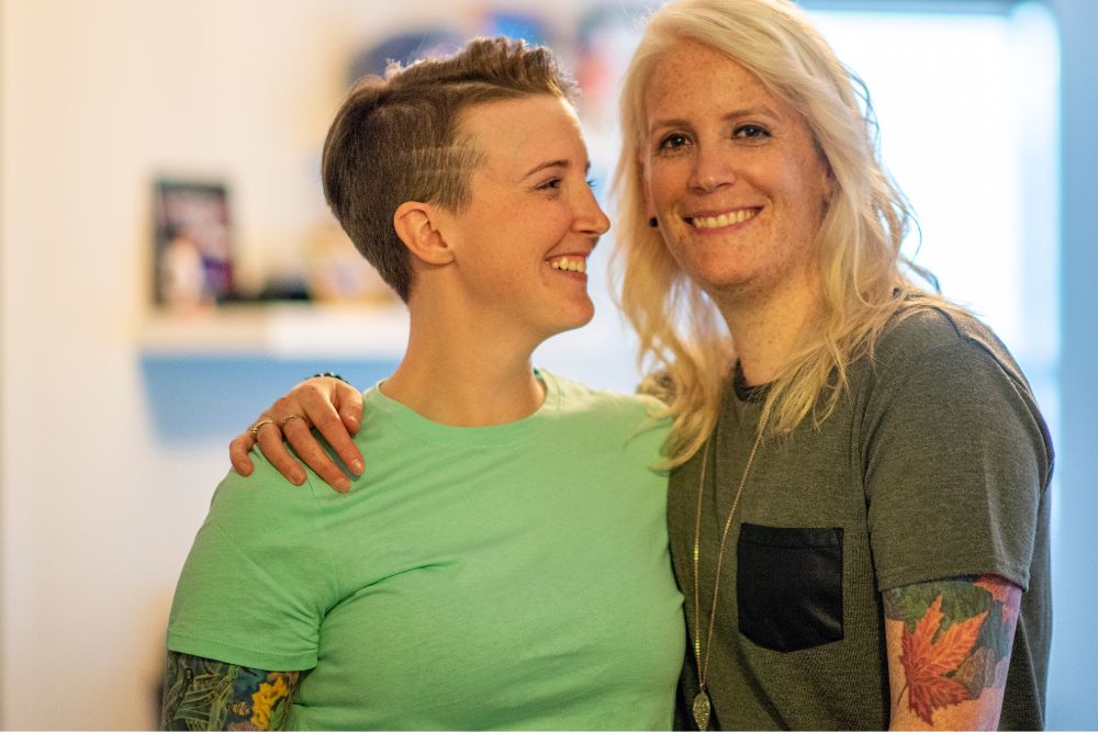 Two millennial women, one looking at the other. Looking to find and LGBTQ+ Affirming therapist in Evanston, IL? They can give you the information you may need about LGBTQ+ Affirming Therapy in Illinois today!
