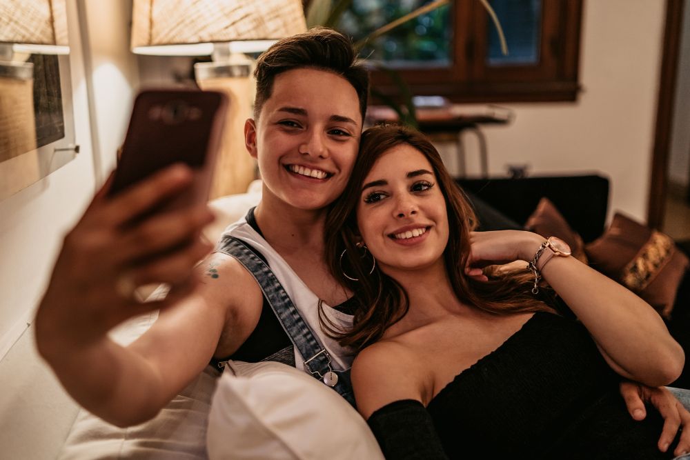 A Women couple taking a selfie together. Want to heal from LGBTQ+ trauma? It might be time to seek out LGBTQ+ Affirming Therapy in Evanston, IL. Speak with an LGBTQIA+ Affirming therapist in Illinois today to learn more!