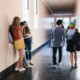 High school students walking and talking in a hallway, capturing the social pressures of senior year—support is available through therapy for teens in Chicago, IL and from a therapist for teens in Evanston, IL.