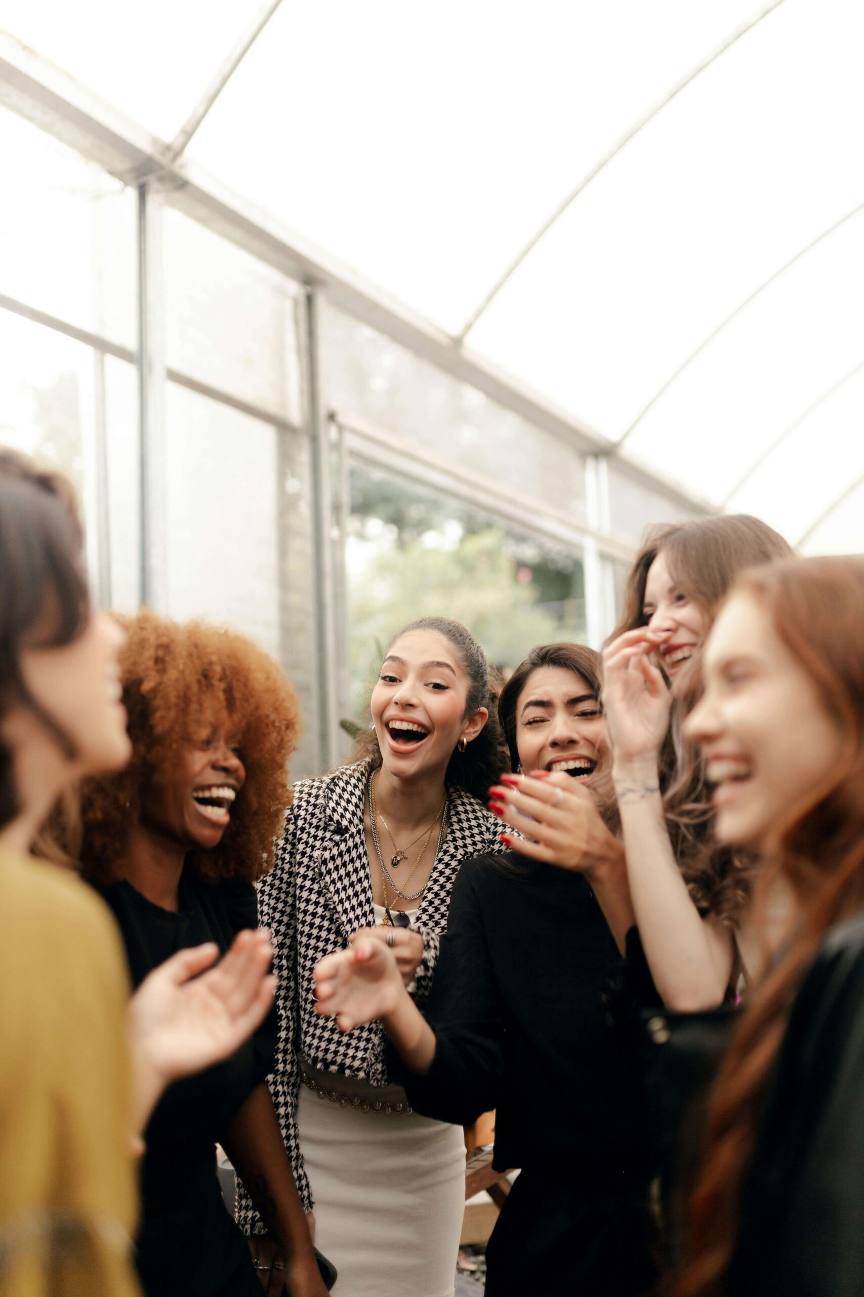 A diverse group of college students laughing together, representing the social connections that can feel hollow during functional depression—a struggle addressed through online therapy for college students in Chicago, IL and cognitive behavioral therapy in Chicago, IL.