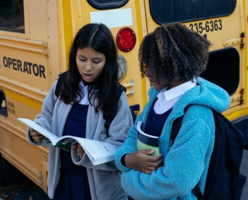 11:12 PMClaude responded: Two teen girls standing by a school bus reviewing papers together, representing the social navigation and academic pressures of high school that can be support…Two teen girls standing by a school bus reviewing papers together, representing the social navigation and academic pressures of high school that can be supported through an online therapist for teens in Evanston, IL and online therapy for teenagers in Evanston, IL.